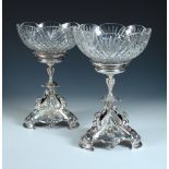 A pair of Victorian electroplated tazze, by Elkington & Co, each raised from a lobed triangular base