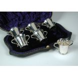 A set of six late Victorian silver two handled tot cups, by Wakeley and Wheeler, London 1900, of