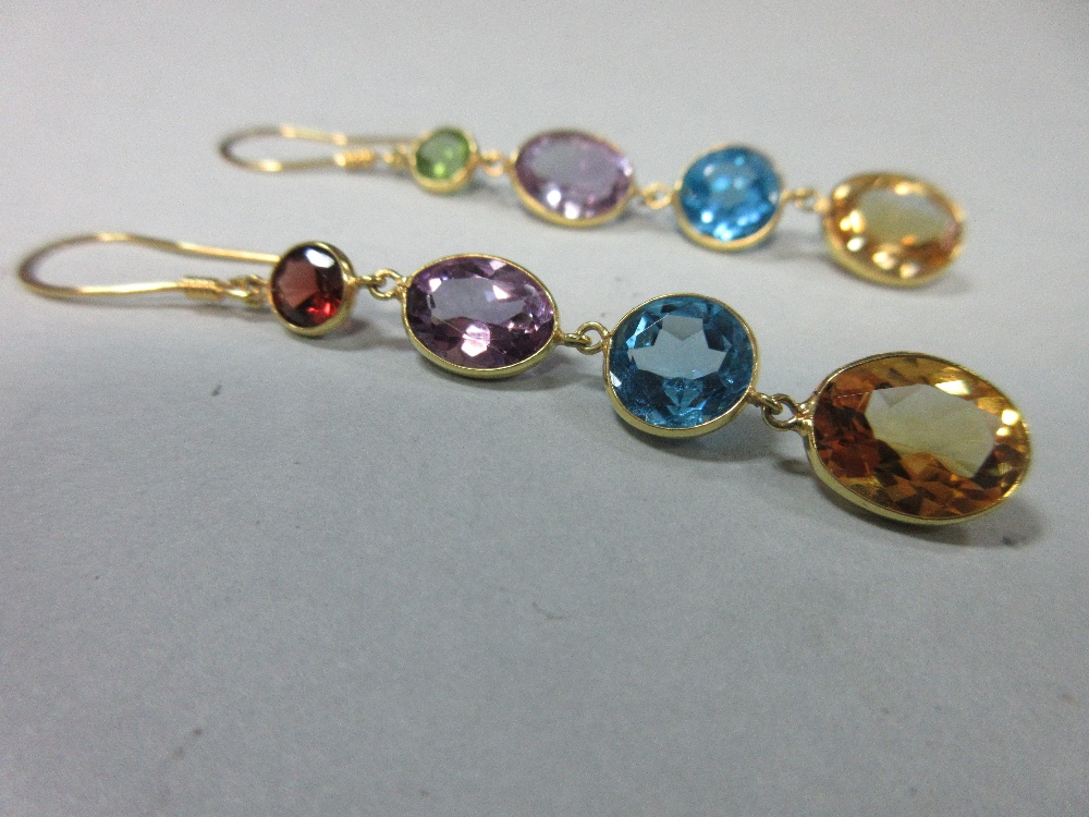A pair of multi-gemset earpendants, each yellow precious metal wire hook suspending a graduated line - Image 2 of 3