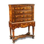 A 19th century Dutch marquetry chest on stand, of four drawers, the stand with a shaped apron, on