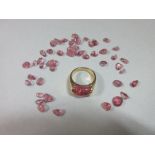 Bulgari: an 18ct gold and pink tourmaline ring, together with a parcel of loose cut pink