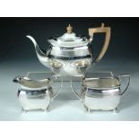 A silver George III style three piece tea set, by the Atkin Brothers, Sheffield 1935, comprising:- a