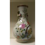 A Chinese famille rose vase, painted with peonies growing by a blue rock, the waisted neck applied