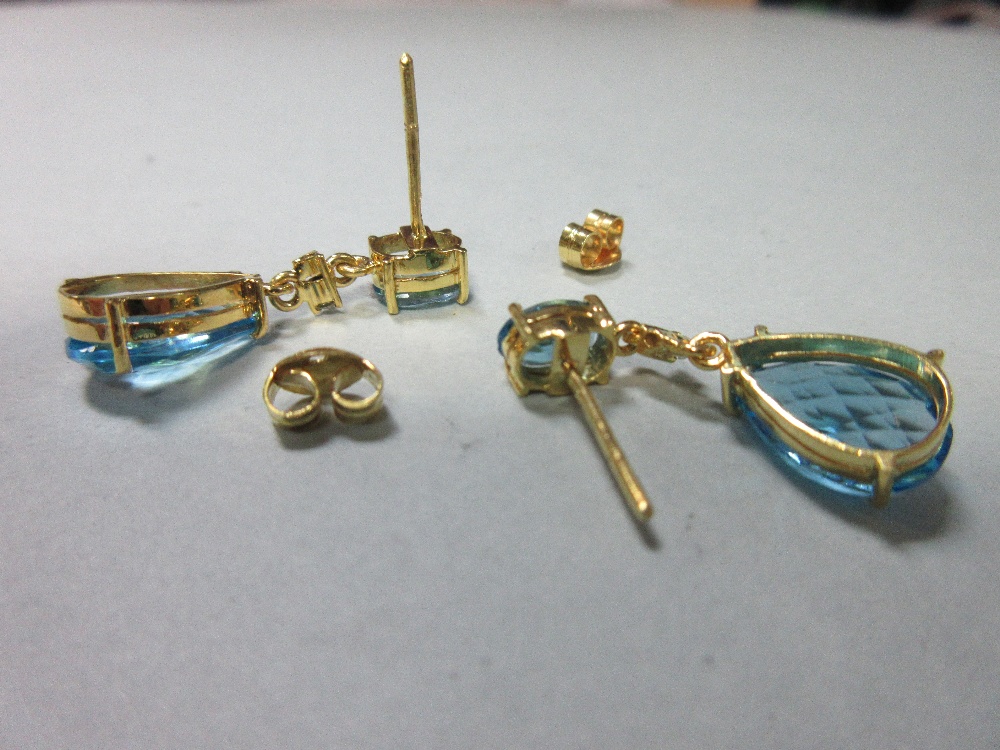 A pair of blue topaz earpendants with diamond highlights, each post headed by an oval cut blue topaz - Image 2 of 3