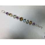 A contemporary multi gemset bracelet, the variously round, oval and pearcut citrines, amethysts,