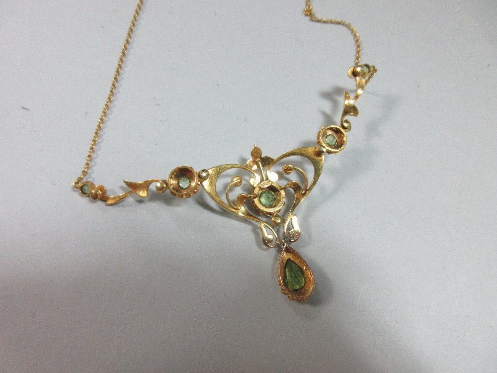 An Edwardian peridot and pearl necklace, the central art nouveau style motif set with a round cut - Image 4 of 7