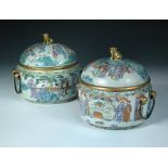 A pair of 19th century Chinese ice pails, liners and covers painted with figures gathered in gardens