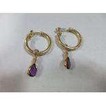 A pair of 18ct gold ear hoops with removable amethyst pendant drops, the hollow hoops with reeded