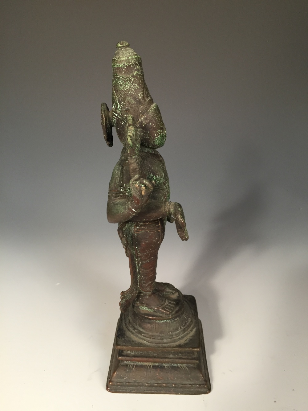 An Indian bronze figure, possibly Vishnu, the four-armed deity standing, his lower hands in - Image 2 of 4