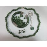 A quantity of jade jewellery, to include a jadeite jade chinese bi pendant on a curb link Italian