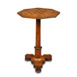 A William IV rosewood chess top pedestal table, the fixed octagonal top on an octagonal tapering