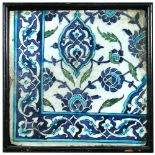 An Islamic pottery tile, probably 16th century Syrian, painted in blue, turquoise and green with