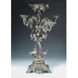 A large Victorian electroplated table centrepiece, by Mappin & Webb, the triform base with applied