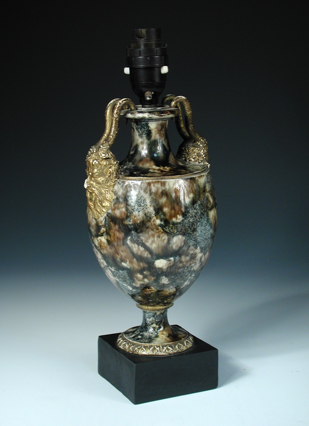 A Wedgwood and Bentley agate ware vase as a lamp, the horns of the gilt satyr mask handles on the