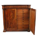 A late Regency mahogany collectors cabinet, flame figured veneers, blind frieze drawers, above two