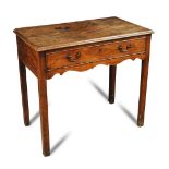 A George III mahogany side table, with single drawer, original brass swan neck handles, a shaped