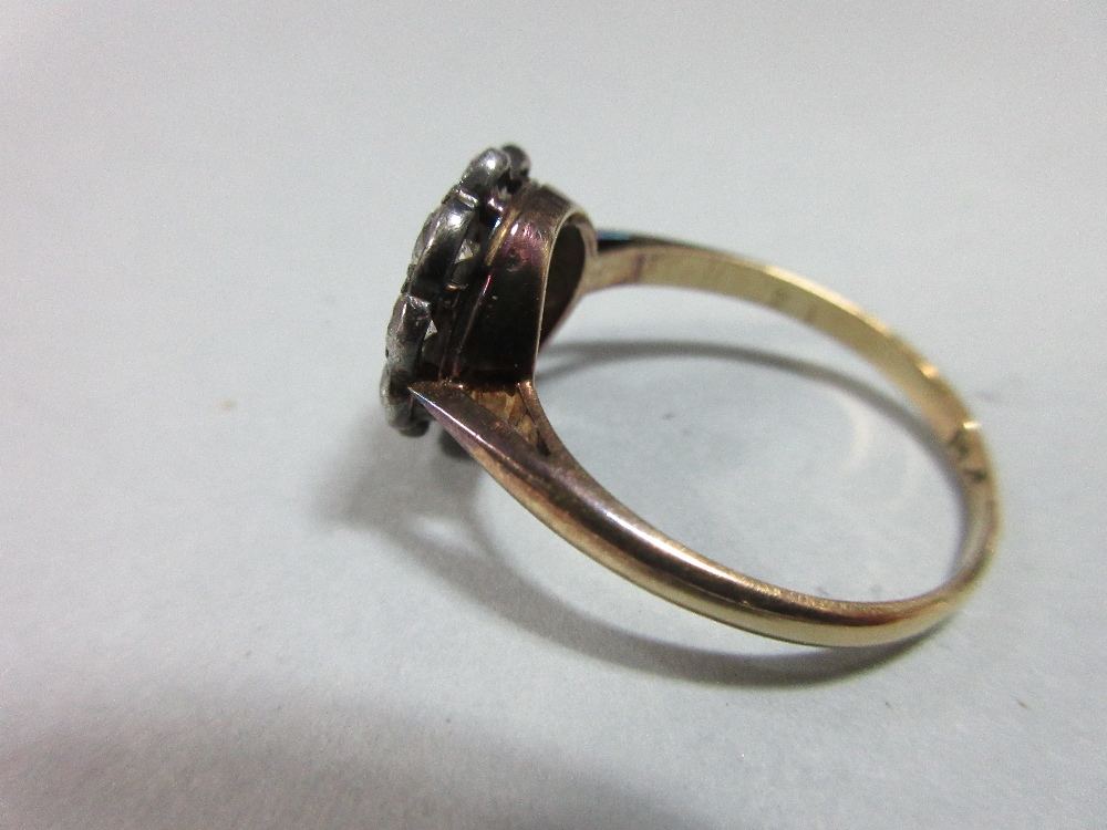 A diamond pierced cluster ring, with a central millegrain collet set round brilliant cut diamond - Image 4 of 7