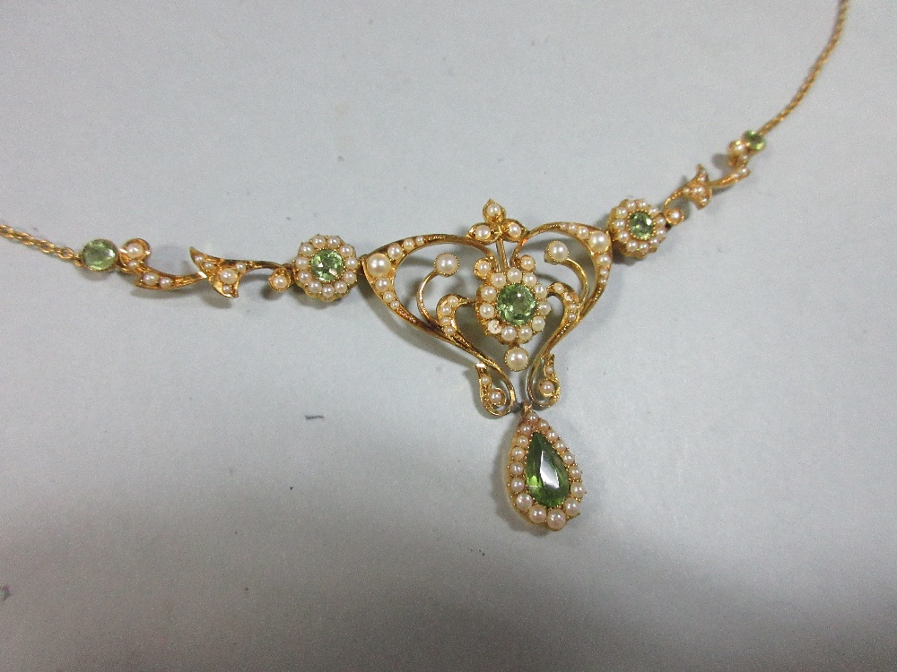 An Edwardian peridot and pearl necklace, the central art nouveau style motif set with a round cut - Image 2 of 7