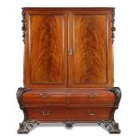 A carved mahogany bombe linen press to a design by Thomas Chippendale, circa 1900, with stepped