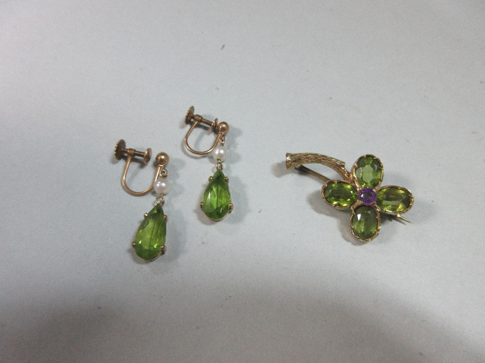 A peridot and amethyst brooch together with a pair of peridot and seed pearl earpendants, the brooch