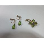 A peridot and amethyst brooch together with a pair of peridot and seed pearl earpendants, the brooch