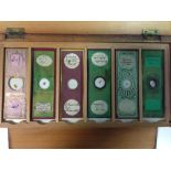 A pine box of microscope slides, each of the twelve trays filled with six slides prepared by Watson,