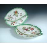 A pair of Red Anchor Chelsea leaf dishes, within the form of two green edged leaves placed