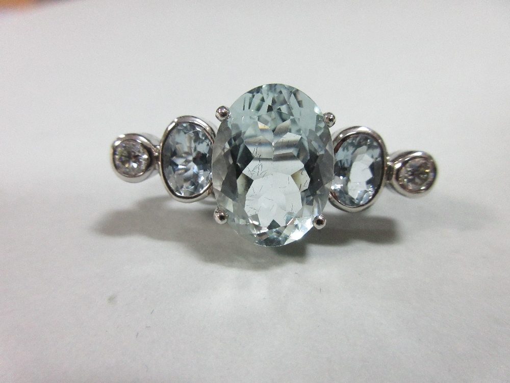 An aquamarine and diamond brooch by Caroline Curtis Dolby, set in 18ct white gold, and designed as a