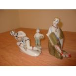 Two Polonnoe sportsmen and another by Lomonosov, the ice hockey player 19cm high, the other of a