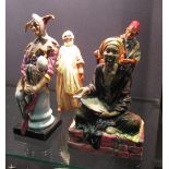A collection of Royal Doulton figures: Mendicant HN1365, Carpet Seller HN1464, Ibrahim HN2095, The