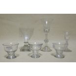 An 18th century wine glass with bell shaped bowl and knot to stem on raised foot, together with