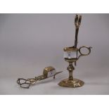 An 18th century brass candle snuffer and stand
