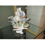 WITHDRAWN - A Ghzel porcelain group of a couple riding a grey wolf , 26cm wide and a