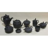 A collection of Black Basalt wares, one marked for Wedgwood, nine pieces plus covers