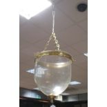 A large glass and brass mounted hanging lamp