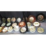 A collection of framed Prattware pot lids