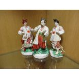 Two Kiev porcelain figures of Odarka and another of Ivan Karas based on the comic opera, she