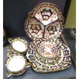 A quantity of Royal Crown Derby Imari pattern tea and dinnerwares to include cups and saucers,