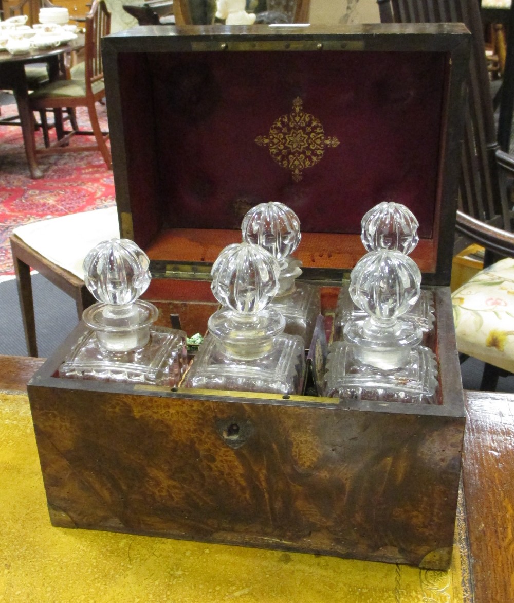 A burr elm decanter box and five decanters