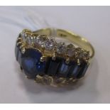 A sapphire and white hardstone ring,