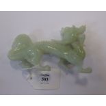 A Chinese greenstone dragon in brocaded box