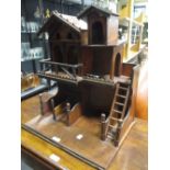 A wooden model stables, Continental construction, late 19th or early 20th century, 49 cm high.