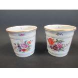 A pair of floral painted ceramic vases