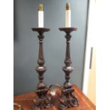 A large pair of carved table lamps