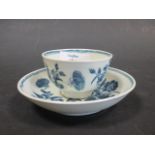 An 18th century Worcester blue and white floral tea bowl and saucer
