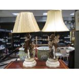 A pair of figural ceramic table lamps