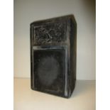 A Chinese black inkstone dated 1722 with a relief carved panel of a qilin amongst clouds, 8 x 25 x