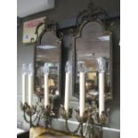 A pair of wrought iron mirrored lights