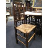 A set of seven Lancashire style rush seated dining chairs