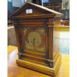 A late 19th century oak cased bracket clock with classical pediment and square brass dial, to an